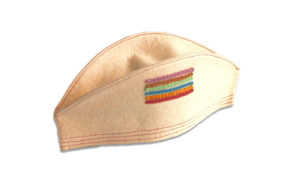 White felt Service Cap for Juniors ages 12-16, submitted by member. The Cap displays all 5 merit stripes, meaning that the member achieved the highest rank of Service Captain.