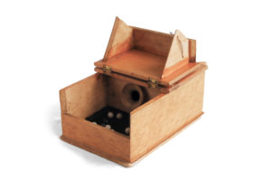 A secret ballot box, used to vote in prospective Degree of Honor lodge members. Existing members were each given a white and black marble, denoting a favorable or unfavorable vote. According to Degree of Honor ritual, the presence of three or more black balls resulted in an "unfavorable" vote.